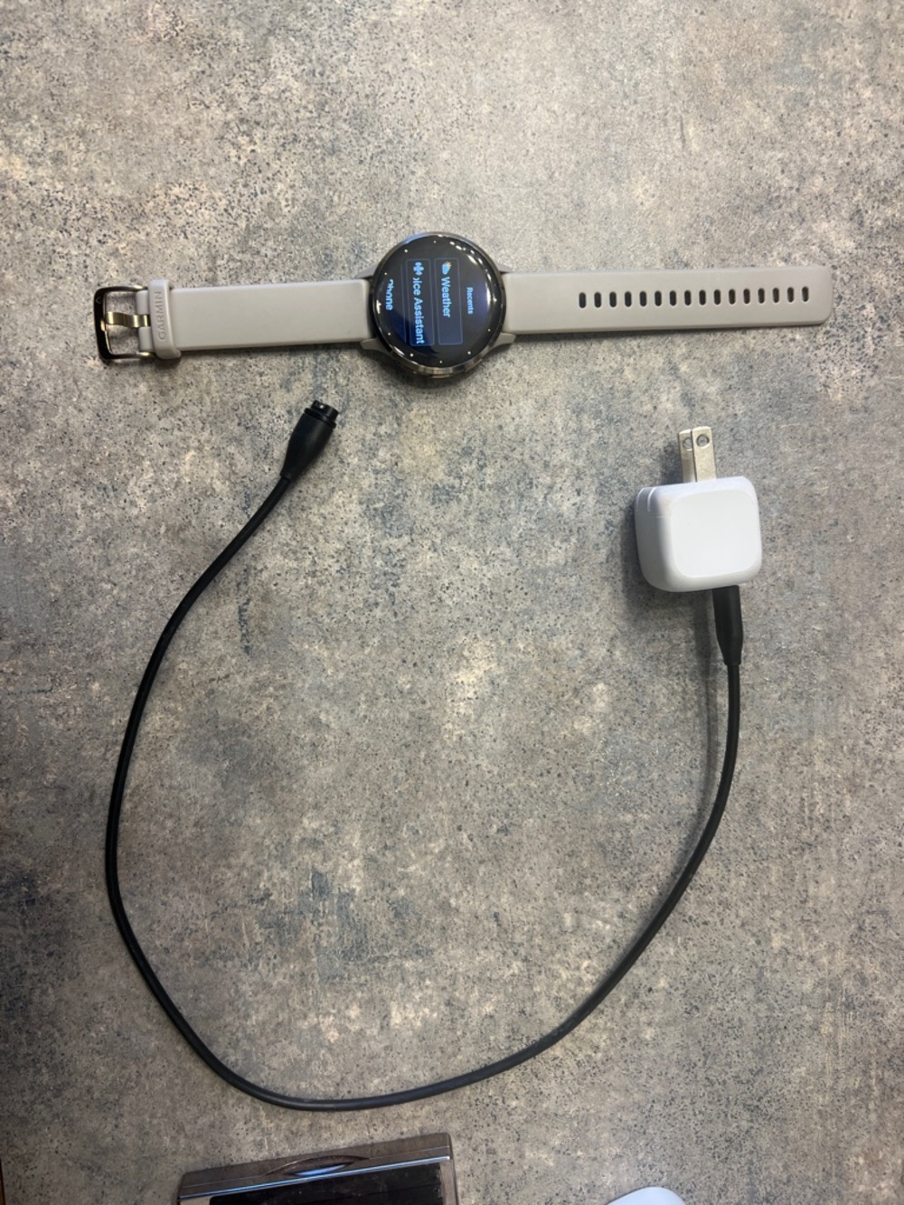 Round Smartwatch in Light Gray and Silver with Charging Cable